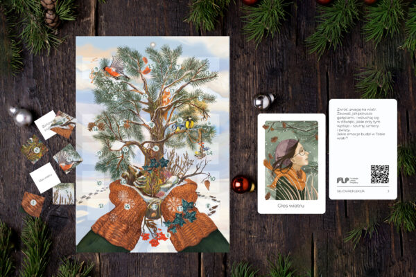 Postcard on a Christmas theme on a wooden table with a Christmas tree and decorations